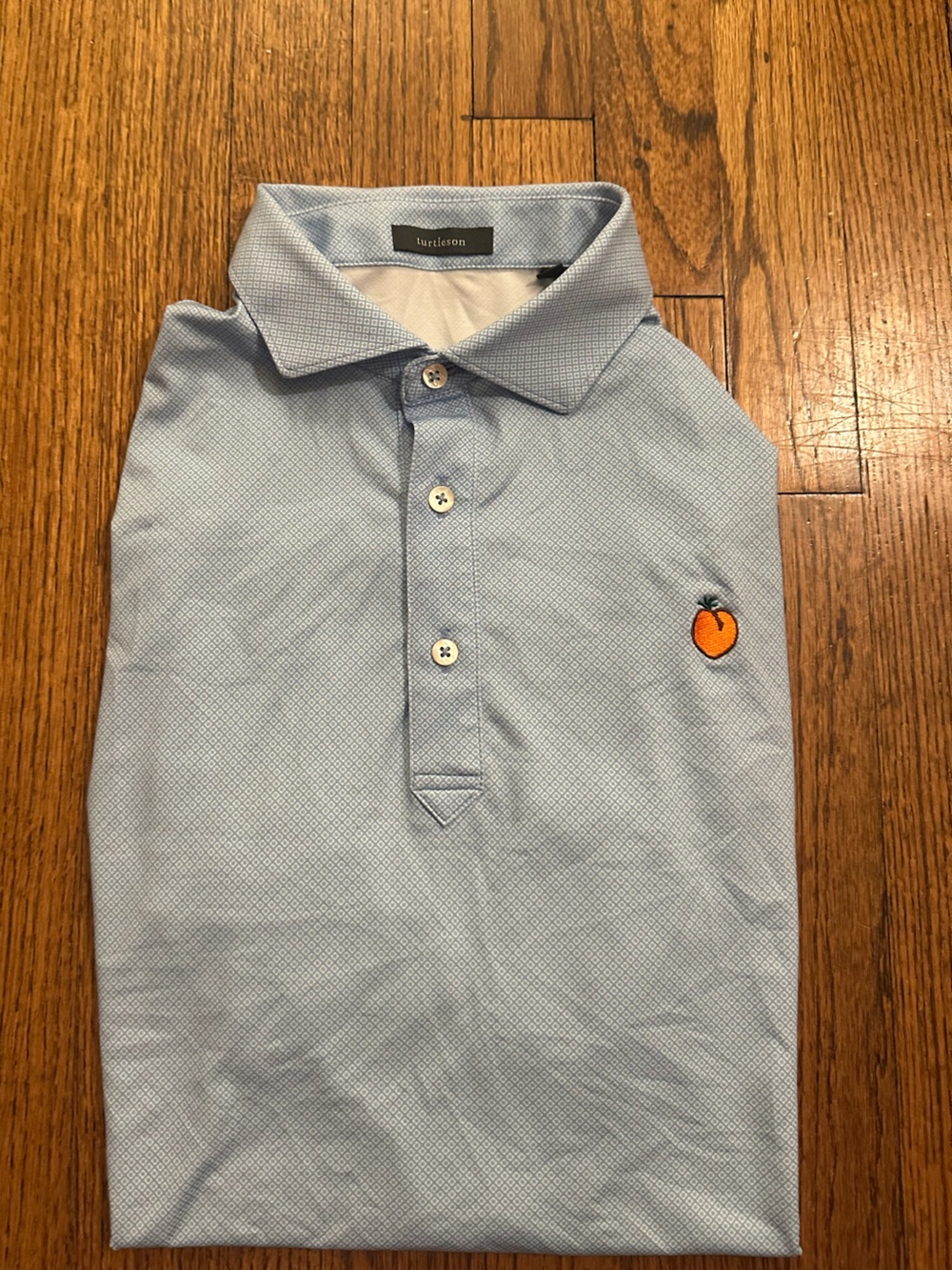Turtleson Light Blue Polo Shirt with Peach Logo